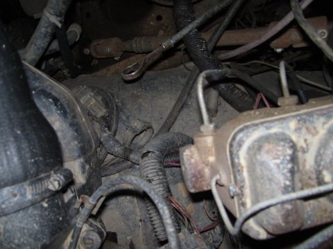 1986 Ford Bronco - Engine bay wiring and brake system components are visible in this close-up shot.