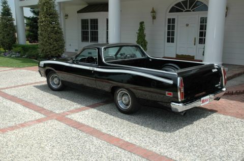 1972 Ford Ranchero - This 1972 Ford Ranchero features a distinctive white stripe along its side and a classic pickup bed.