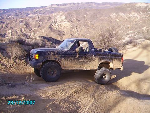 1990 Ford Bronco - This Ford Bronco is covered in mud after driving on a rough, off-road trail.