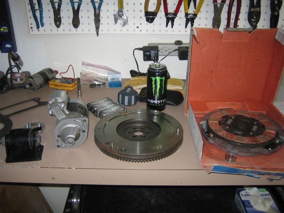 Clutch and flywheel assembly with starter motor and Monster Energy can