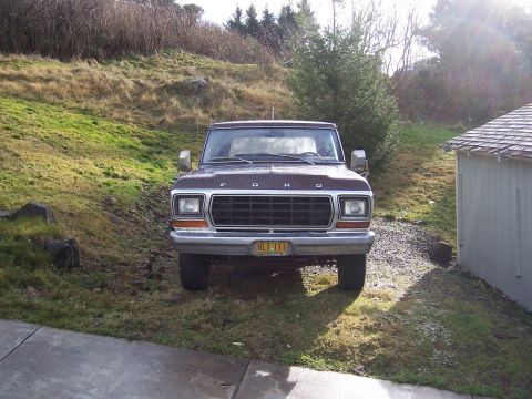 1978 Ford Bronco - This Ford truck has a prominent grille and a license plate reading RLT-111.
