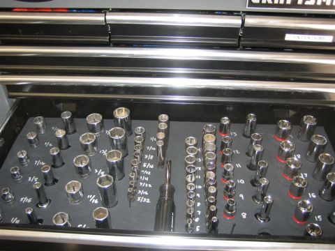 1994 Ford Bronco - A drawer filled with various sizes of sockets and a screwdriver.