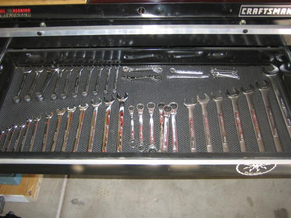 Tool drawer filled with various sizes of wrenches