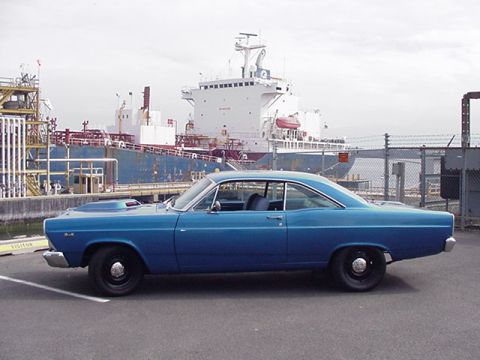 1966 Ford Fairlane - Side view of a blue 1966 Ford Fairlane coupe with a scoop on the hood.