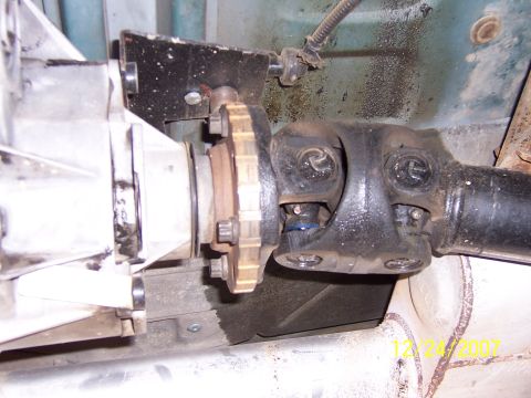 1994 Ford Bronco - Driveshaft connection to transfer case, showing U-joint and flange detail.