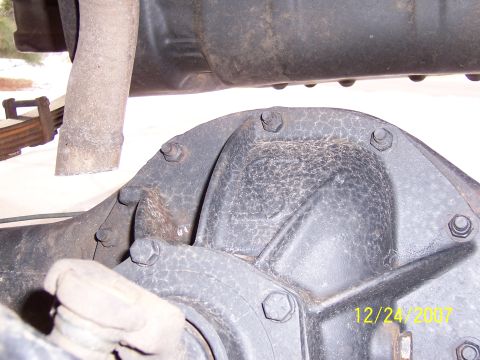 1994 Ford Bronco - Close-up view of a vehicle's rear differential and exhaust pipe, with a date stamp visible in the lower right corner.