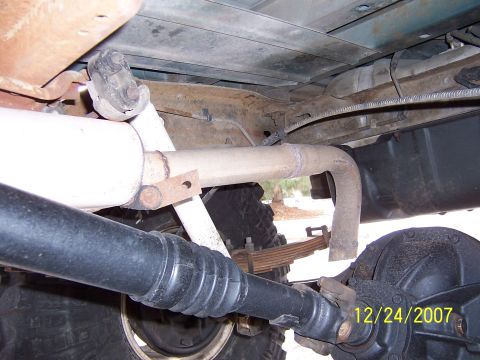 1994 Ford Bronco - This photo shows the undercarriage of a vehicle, focusing on the exhaust system and drivetrain components.