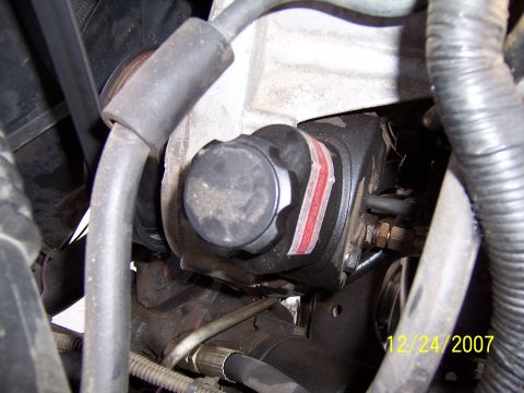1994 Ford Bronco - Close-up of a vehicle's power steering pump with visible hoses and fittings, dated 12/24/2007.