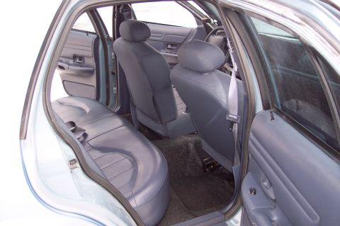 2001 Ford Crown Victoria - The interior of a 2001 Ford Crown Victoria is shown, dark blue cloth seats and door panels.