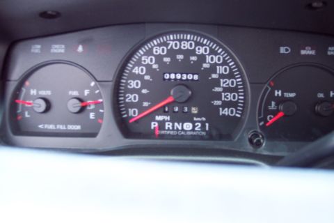 2001 Ford Crown Victoria - Interior view of a car's dashboard, displaying various gauges and an odometer reading.