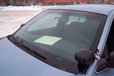 2001 Ford Crown Victoria - Interior view of a light blue police car, showing the dashboard with a note placed on it.