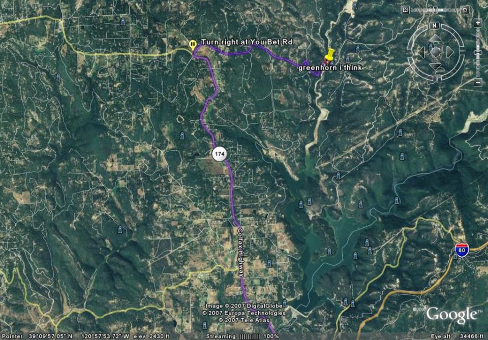 Satellite map showing a route overlay with text labels and road markers