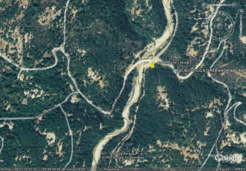 Aerial view of a rural area with roads, a river, and the Pacific Silica Greenhorn Plant