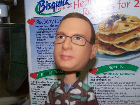 1973 Ford Ranchero - A bobblehead figure stands before a Bisquick box recipes for blueberry pancakes and biscuits.