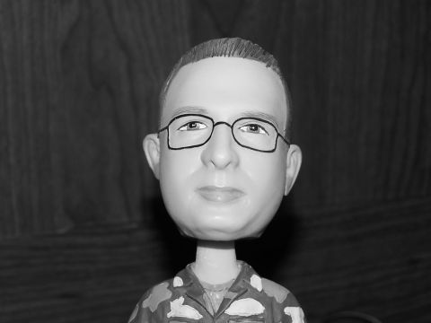 1973 Ford Ranchero - This is a bobblehead figure with glasses and a camouflage shirt.