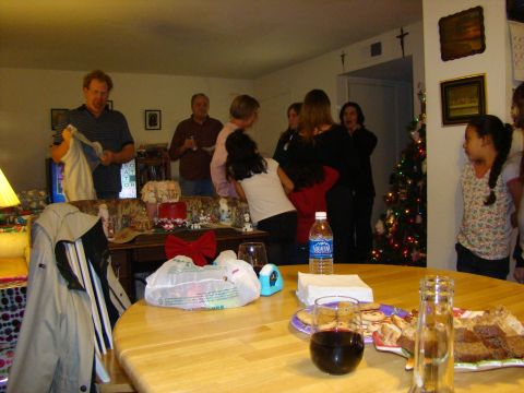 1989 Ford Bronco - A group of people are gathered in a room, with a decorated Christmas tree visible in the background.
