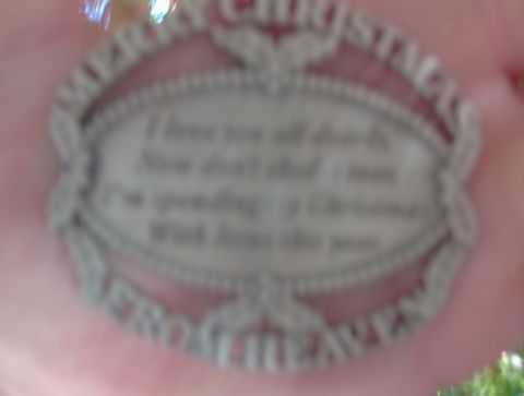 1978 Ford Bronco - Christmas ornament with engraved text held in a hand.