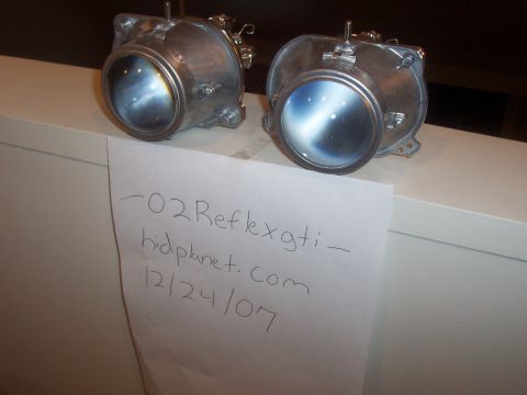 1993 Ford Probe - Two headlights are shown, with a handwritten note indicating they are for an "02 Reflex GTI" and dated 12/24/07.