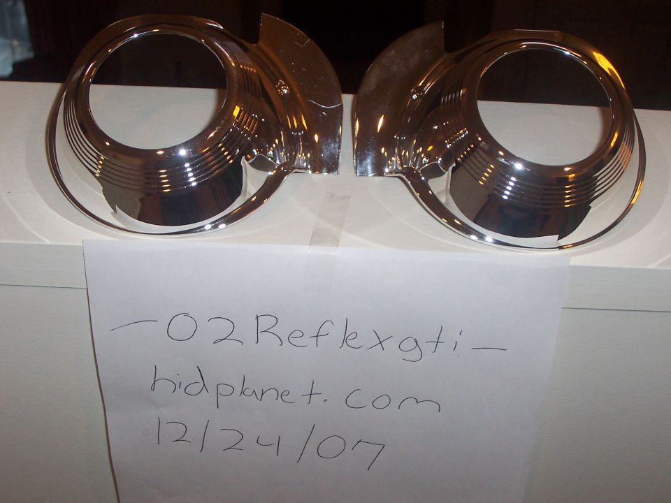 Pair of chrome headlight bezels with ribbed detailing