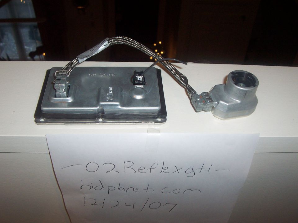 HID ballast and igniter assembly with handwritten label "-02 Reflexgti - hidplanet.com 12/24/07"