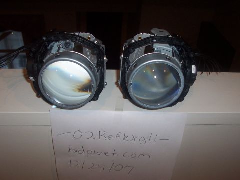 1993 Ford Probe - A pair of disassembled headlights are shown, with a note indicating "-02 Reflexgti-" and a date.