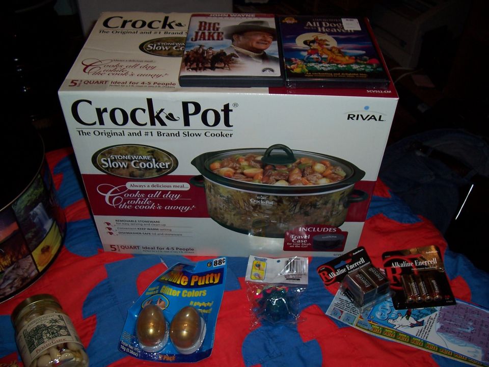Crock-Pot slow cooker box with two DVDs, batteries, and glitter putty