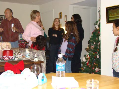 1989 Ford Bronco - A group of people are gathered indoors, with a Christmas tree visible in the background.