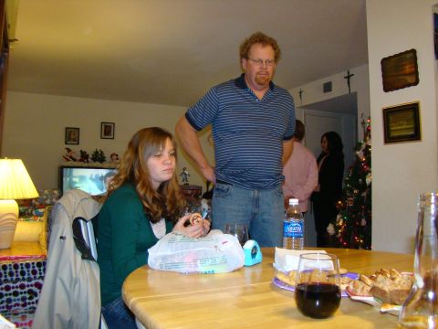 1989 Ford Bronco - A group of people are gathered in a room decorated for Christmas.