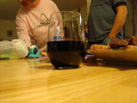 1989 Ford Bronco - A casual gathering with drinks and appetizers on a wooden table, with people visible in the background.