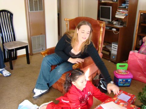 1989 Ford Bronco - A woman and a child are opening presents indoors.