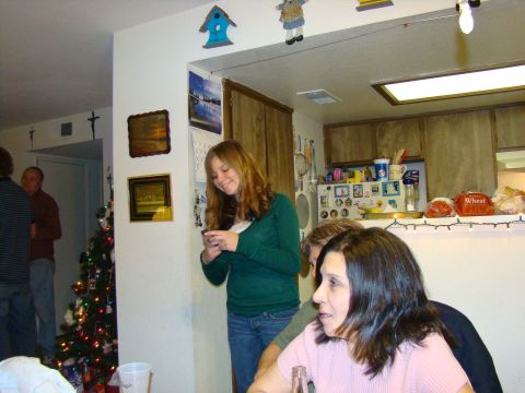 1989 Ford Bronco - People are seen in a room decorated for Christmas, with a decorated tree visible on the left.