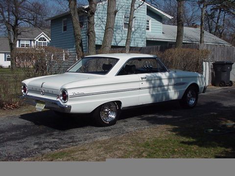 1966 Ford Fairlane - This white 1963 Ford Falcon coupe is seen from a three-quarter front angle, parked in a residential driveway.