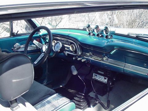 1966 Ford Fairlane - Interior view of a 1963 Ford Falcon, a turquoise dashboard and aftermarket gauges.