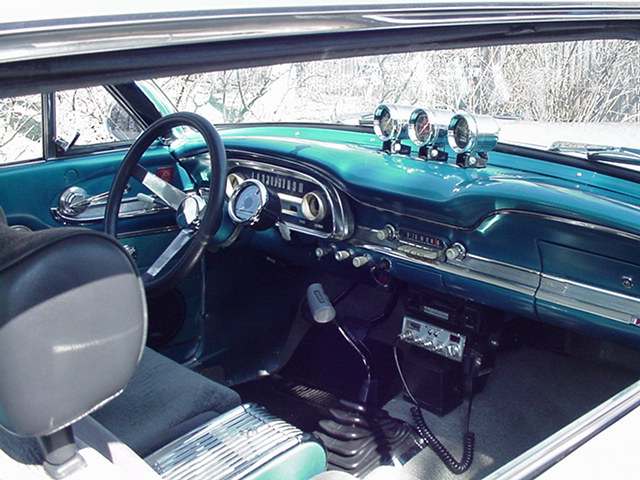 1963 Ford Falcon interior, turquoise dash with aftermarket gauges and radio