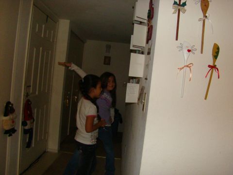 1989 Ford Bronco - Two girls in a hallway with decorated spoons on the wall.