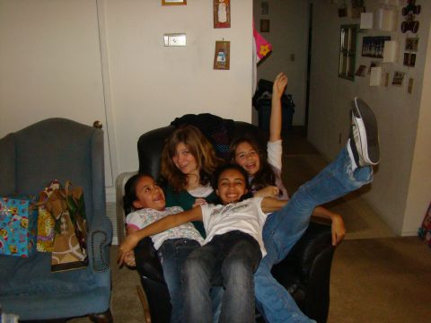 1989 Ford Bronco - Four girls are gathered together on a couch, appearing to be having fun.