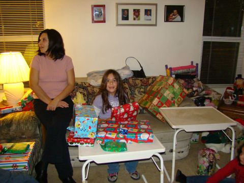 1989 Ford Bronco - A family gathers in a living room surrounded by Christmas gifts.
