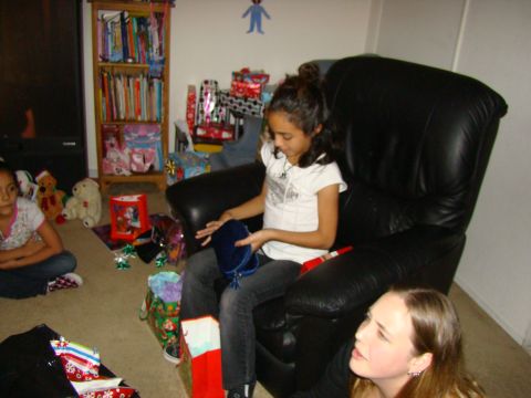 1989 Ford Bronco - Children opening Christmas presents in a living room setting.