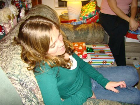 1989 Ford Bronco - A woman relaxes on a couch surrounded by wrapped Christmas gifts.