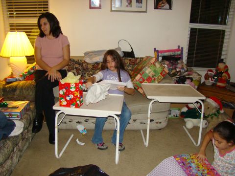 1989 Ford Bronco - A family opens presents during a holiday celebration.
