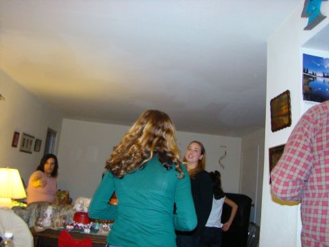 1989 Ford Bronco - A group of people are seen socializing in an indoor setting, with decorations suggesting a festive occasion.
