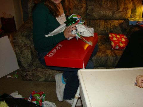 1989 Ford Bronco - A person unwraps a large red JCPenney gift box during the holidays.