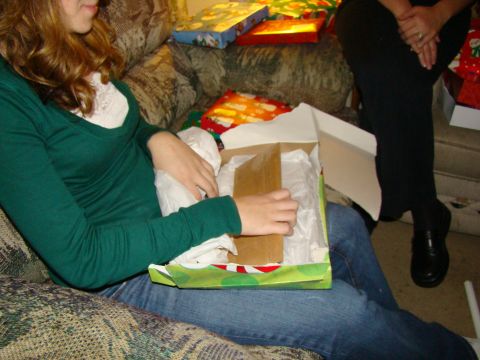 1989 Ford Bronco - People are opening gifts on a couch during Christmas.