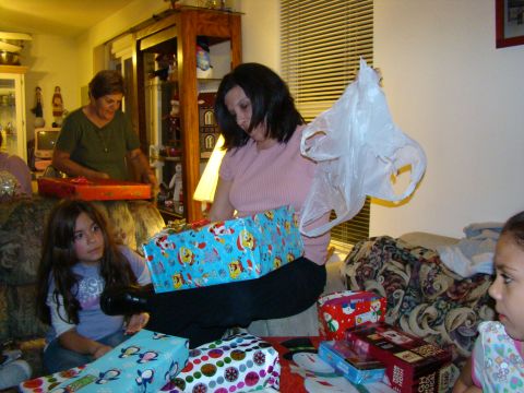 1989 Ford Bronco - A family gathers to open presents during a holiday celebration.
