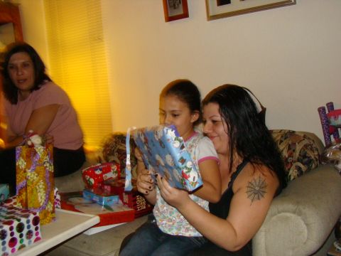 1989 Ford Bronco - Family members opening presents during a holiday celebration.