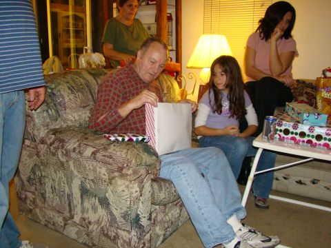 1989 Ford Bronco - Family gathers to open presents during a holiday celebration.