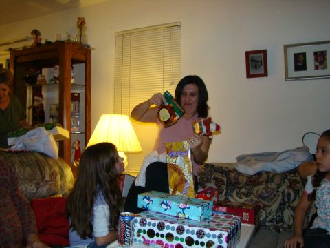 1989 Ford Bronco - A holiday gathering with people opening presents in a living room setting.