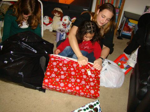 1989 Ford Bronco - A holiday scene of people opening presents on the floor.