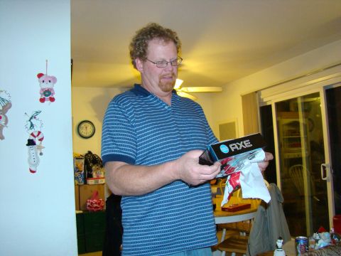 1989 Ford Bronco - A man opens a gift box with the AXE logo visible.
