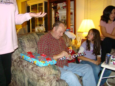 1989 Ford Bronco - Family gathers for Christmas, opening presents in a living room setting.
